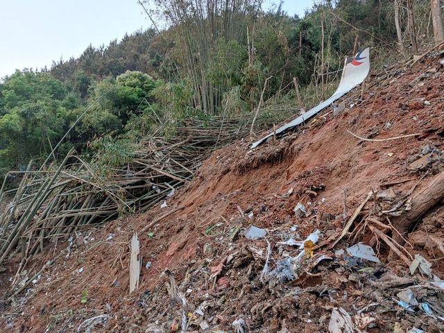 Plane wreckage found by rescuers at the crash site in Teng County, Guangxi